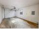 Spacious garage providing ample room for parking and storage, with a roll up door at 2714 Manlove Ave, Indianapolis, IN 46218