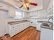 Bright kitchen featuring white cabinets, a window over the sink, and ample counter space at 2714 Manlove Ave, Indianapolis, IN 46218