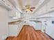 Functional kitchen with ample cabinet space and laminate wood flooring throughout at 2714 Manlove Ave, Indianapolis, IN 46218