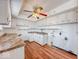 Well-lit kitchen offers generous storage with all-white cabinetry and a double basin sink at 2714 Manlove Ave, Indianapolis, IN 46218