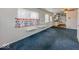 Bright living area featuring built-in shelving and a partial view into the kitchen at 2714 Manlove Ave, Indianapolis, IN 46218
