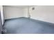 Spacious living room featuring a large window and blue carpeting at 2714 Manlove Ave, Indianapolis, IN 46218