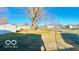Extensive backyard space with a shed, enclosed by a chain-link fence, offers outdoor possibilities at 283 N Brooks St, Columbus, IN 47201