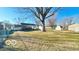 Large backyard with a chain link fence and mature trees offering privacy at 283 N Brooks St, Columbus, IN 47201
