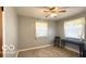 Bedroom with natural light, wood-look floors, and neutral walls at 283 N Brooks St, Columbus, IN 47201