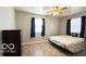 Comfortable bedroom with a ceiling fan and a window at 283 N Brooks St, Columbus, IN 47201