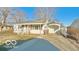 Cozy one-story home with a covered carport and well-maintained front yard at 283 N Brooks St, Columbus, IN 47201