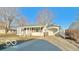 A bright and sunny single-story home featuring an attached garage and a well-maintained front yard at 283 N Brooks St, Columbus, IN 47201