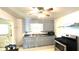 Charming kitchen featuring ample cabinet space, laminate countertops and vintage-style flooring at 283 N Brooks St, Columbus, IN 47201