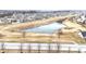 Aerial view of a neighborhood pond, adding a touch of nature to the community at 2879 Bluewood Way, Plainfield, IN 46168