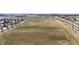 An aerial view of a sports field surrounded by homes in a suburban neighborhood, showcasing the community's green space at 2879 Bluewood Way, Plainfield, IN 46168