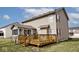 A sunny backyard featuring an inviting wood deck, perfect for outdoor relaxation and entertaining at 2879 Bluewood Way, Plainfield, IN 46168