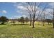 The expansive backyard is a peaceful outdoor escape with mature trees and plenty of open green space at 2879 Bluewood Way, Plainfield, IN 46168
