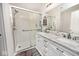 Bathroom featuring a walk-in shower, double sink vanity with marble countertop at 2879 Bluewood Way, Plainfield, IN 46168