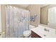 Bathroom with a tub and shower combination, featuring a seashell themed shower curtain at 2879 Bluewood Way, Plainfield, IN 46168