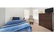 Cozy bedroom featuring natural light from the windows and a dresser for storage at 2879 Bluewood Way, Plainfield, IN 46168