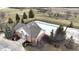 Aerial view showcases the fenced community pool, ready for summer fun and relaxation at 2879 Bluewood Way, Plainfield, IN 46168