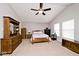 Bedroom with a ceiling fan, carpet, a large window and matching furniture at 2879 Bluewood Way, Plainfield, IN 46168