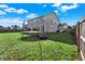 Lush backyard with a trampoline and access to a deck, offering plenty of space for outdoor activities at 2912 Tuscarora Ln, Indianapolis, IN 46217