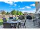 Spacious backyard deck featuring a dining table, lounge seating, and a peaceful outdoor ambiance at 2912 Tuscarora Ln, Indianapolis, IN 46217