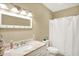 Bathroom featuring a sink with cabinet and a shower at 2912 Tuscarora Ln, Indianapolis, IN 46217