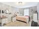 Charming bedroom featuring a cozy bed, bedside table, and stylish decor at 2912 Tuscarora Ln, Indianapolis, IN 46217
