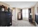 Bedroom featuring carpet flooring, curtains, and a window for natural light at 2912 Tuscarora Ln, Indianapolis, IN 46217