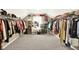 Walk-in closet with carpet flooring and lots of shelving and racks for storage at 2912 Tuscarora Ln, Indianapolis, IN 46217