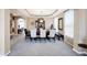 Bright dining room featuring neutral tones, stylish lighting, and ample seating space at 2912 Tuscarora Ln, Indianapolis, IN 46217
