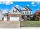Charming two-story home with a manicured lawn, a two car garage, and a covered porch at 2912 Tuscarora Ln, Indianapolis, IN 46217