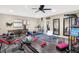 Home gym featuring gym equipment, mirrors, and wood flooring at 2912 Tuscarora Ln, Indianapolis, IN 46217