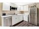Well-equipped kitchen featuring stainless steel appliances and white cabinets at 2912 Tuscarora Ln, Indianapolis, IN 46217