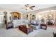 Open-concept living room with a large sectional sofa, and neutral carpeting at 2912 Tuscarora Ln, Indianapolis, IN 46217
