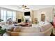 Comfortable living room with a fireplace, TV, ceiling fan and lots of natural light at 2912 Tuscarora Ln, Indianapolis, IN 46217