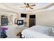 Main bedroom with a fireplace, ceiling fan, carpet flooring, and television at 2912 Tuscarora Ln, Indianapolis, IN 46217