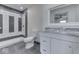 Bathroom features a tiled shower and gray marble vanity at 32 Downing Dr, Trafalgar, IN 46181