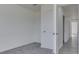 A view of a bedroom with the door open to the hall at 32 Downing Dr, Trafalgar, IN 46181