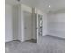 A bedroom with a door ajar to the hallway at 32 Downing Dr, Trafalgar, IN 46181