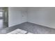 A bedroom with a door ajar to the hallway at 32 Downing Dr, Trafalgar, IN 46181