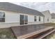The wood deck is an ideal spot for relaxation or entertaining, enhancing the home's outdoor appeal at 32 Downing Dr, Trafalgar, IN 46181
