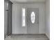 Bright entryway showcasing modern flooring, white walls, and a front door with decorative glass at 32 Downing Dr, Trafalgar, IN 46181