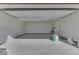 Spacious garage featuring a gray fleck epoxy floor and ample room for parking and storage at 32 Downing Dr, Trafalgar, IN 46181