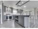 Kitchen featuring stainless steel appliances, subway tile backsplash, barn door, and gray cabinetry at 32 Downing Dr, Trafalgar, IN 46181