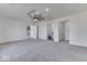 This bedroom features a ceiling fan, bathroom access, and closet at 32 Downing Dr, Trafalgar, IN 46181
