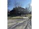 Stately brick home featuring a well-manicured lawn and mature trees offering charm and curb appeal at 3695 Woodfield Pl, Columbus, IN 47203