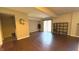 Finished basement featuring laminate flooring and modern lighting, with access to laundry room at 3766 N Lakeside Dr, Muncie, IN 47304