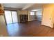 Finished basement featuring laminate flooring, modern lighting, and sliding glass door to the backyard at 3766 N Lakeside Dr, Muncie, IN 47304