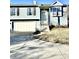 Charming two-story home featuring light blue siding, attached garage, and well-manicured lawn at 3766 N Lakeside Dr, Muncie, IN 47304