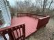 A spacious, red-stained wooden deck offers great outdoor entertaining space at 3837 Candle Berry Dr, Indianapolis, IN 46235