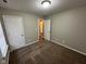 Bedroom featuring carpet, neutral walls, and a white door at 3837 Candle Berry Dr, Indianapolis, IN 46235